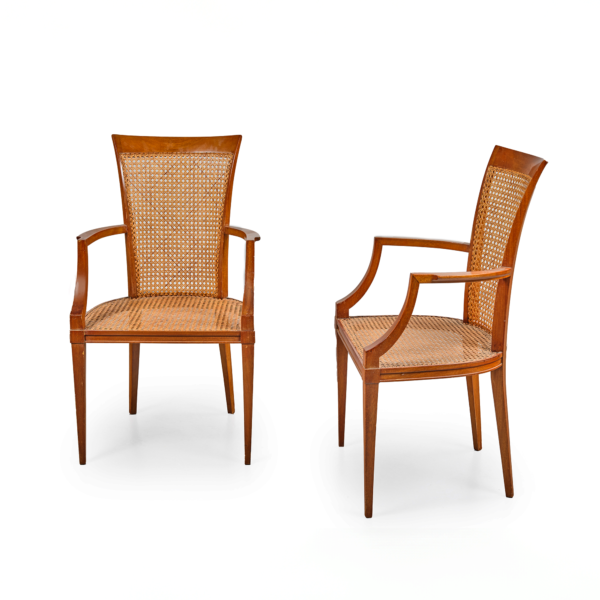 Fauteuils André Arbus acajou cannés accotoirs en ailettes piètement en gaine sabre arrière vers 1950