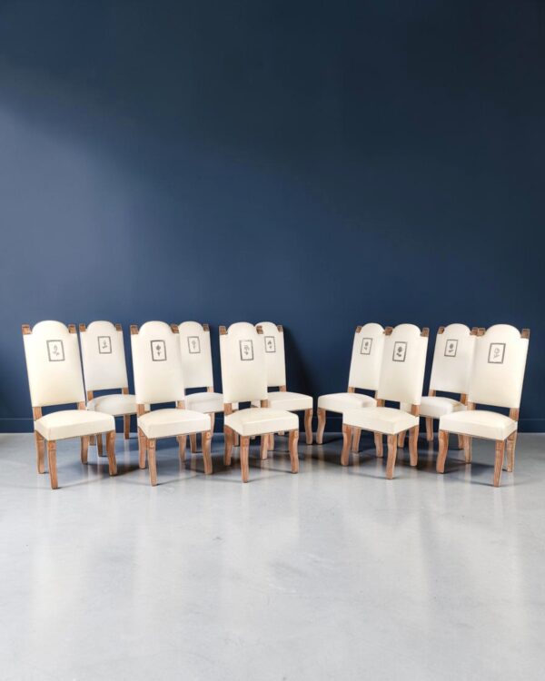 Suite de dix chaises à haut dossier en chêne cérusé, vers 1940