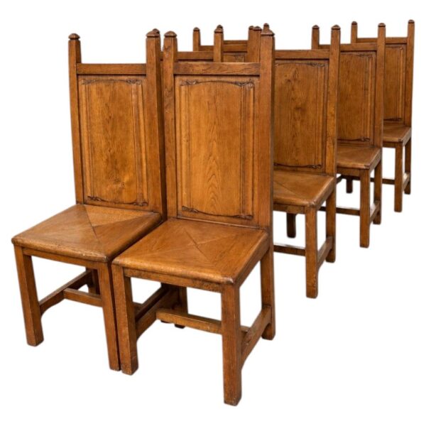 Suite de huit chaises brutalistes en bois massif, travail français, vers 1950